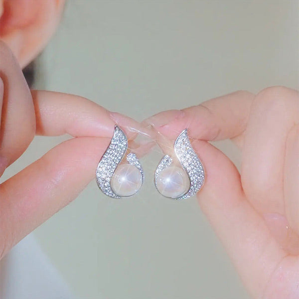 Elegant simulated pearl and rhinestone stud earrings