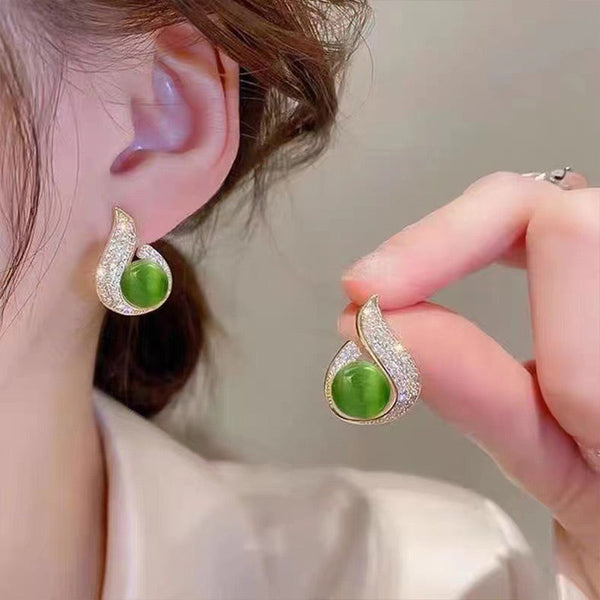 Elegant simulated pearl and rhinestone stud earrings