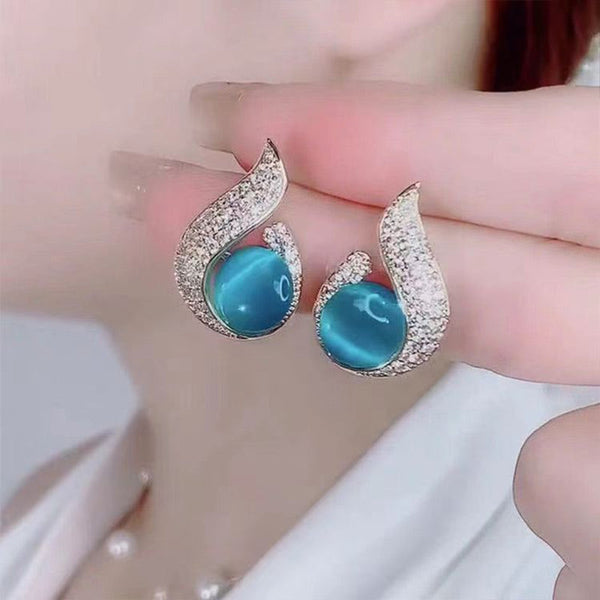 Elegant simulated pearl and rhinestone stud earrings