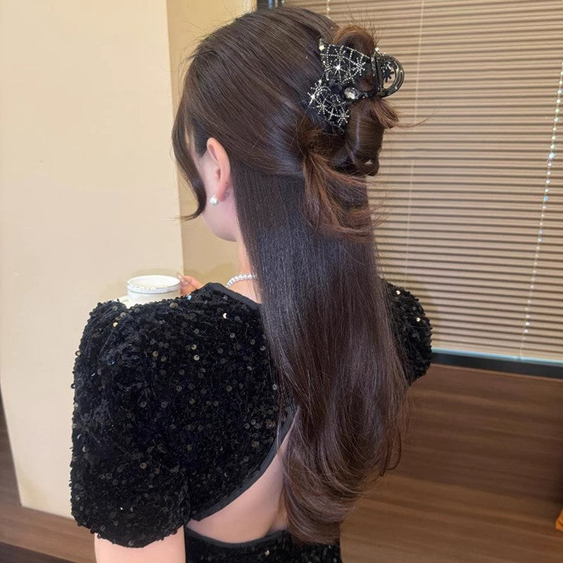 Elegant, sparkling hair clip with bow and artificial diamond
